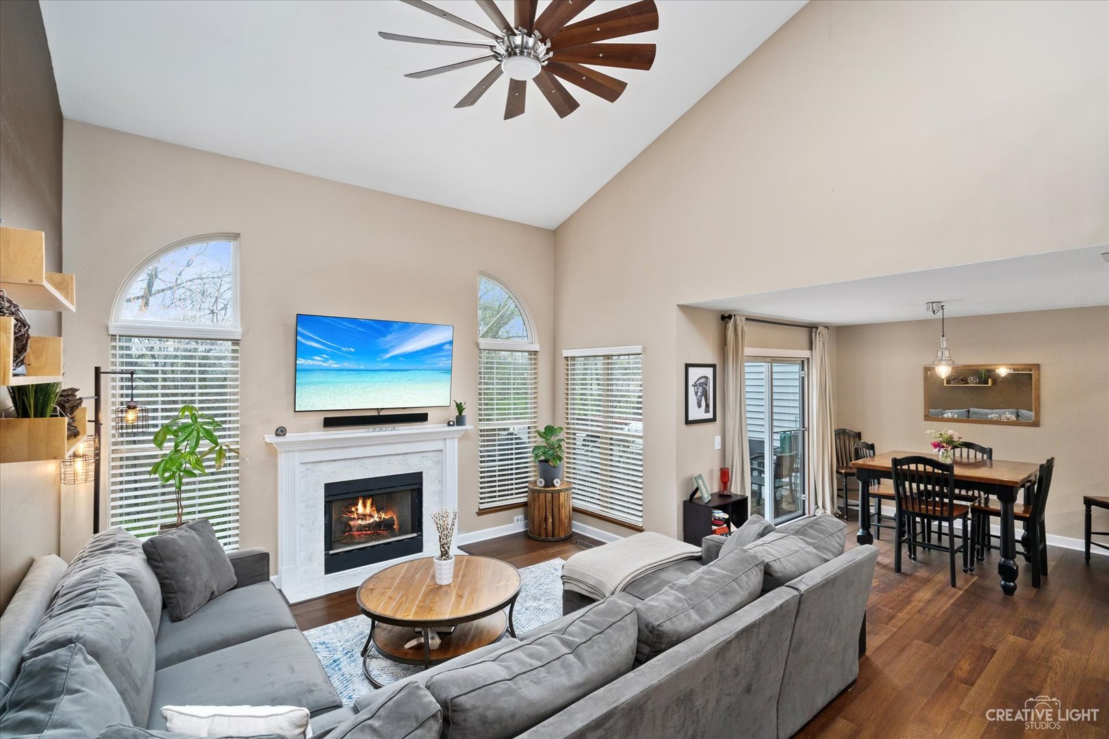 1180 Coldspring Road Elgin, IL 60120 - Photo 3 of 18 a living room with furniture a fireplace and a large window