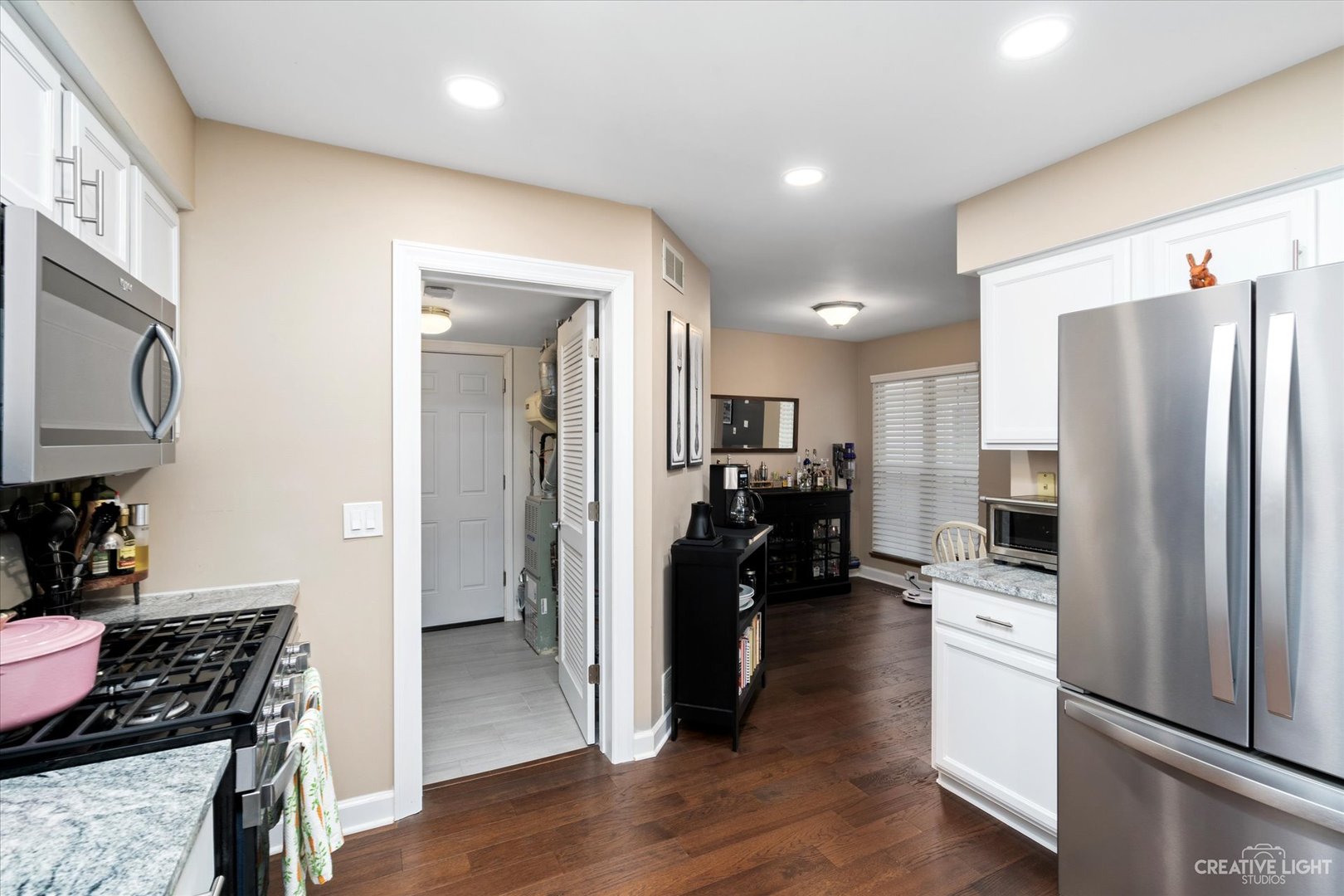 1180 Coldspring Road Elgin, IL 60120 - Photo 7 of 18 a kitchen with stainless steel appliances a refrigerator and a stove top oven