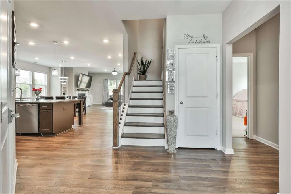 8 Unbridled Way Newnan, GA 30263 - Photo 13 of 49 a view of a kitchen with cabinets and wooden floor