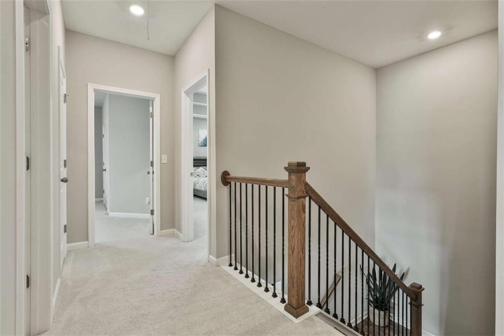 8 Unbridled Way Newnan, GA 30263 - Photo 28 of 49 a view of a hallway with a elevator