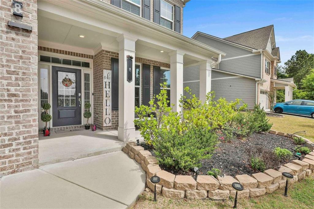 8 Unbridled Way Newnan, GA 30263 - Photo 5 of 49 a front view of a house with garden