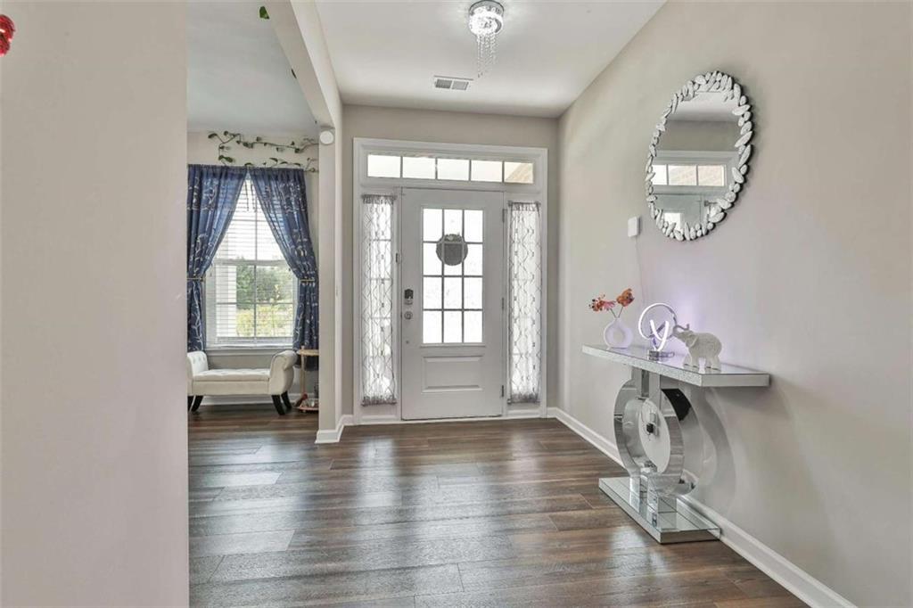 8 Unbridled Way Newnan, GA 30263 - Photo 9 of 49 a view of an entryway with wooden floor