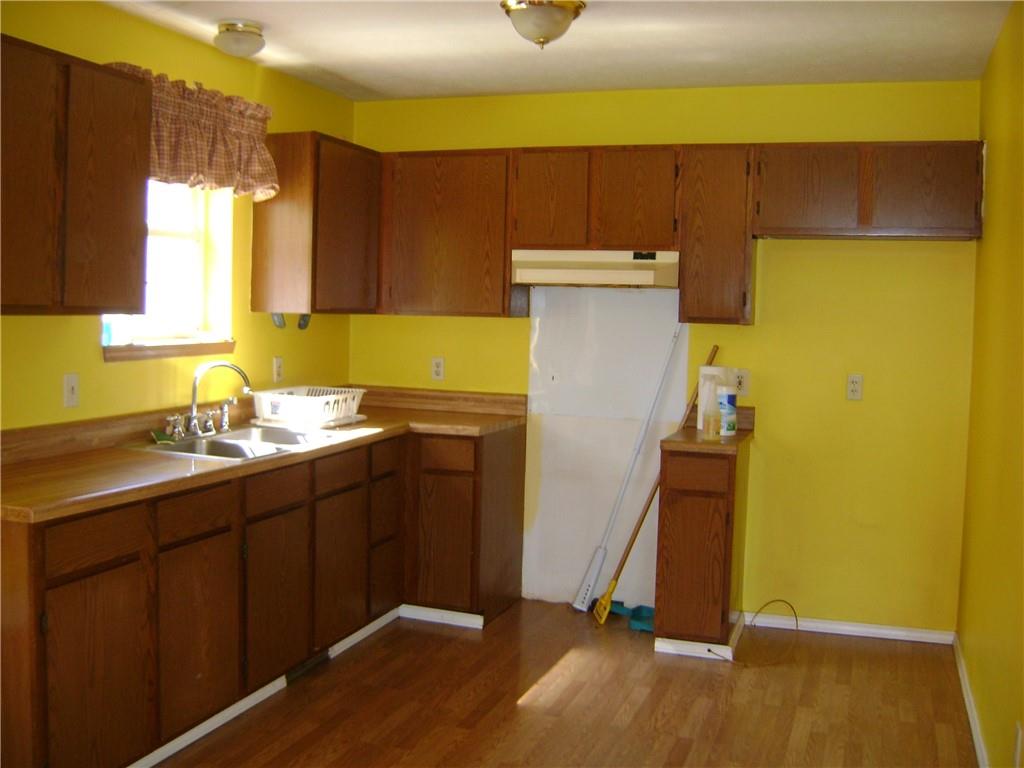 3489 East State Road Jamestown, PA 16134 - Photo 2 of 15 a kitchen with a sink and a refrigerator
