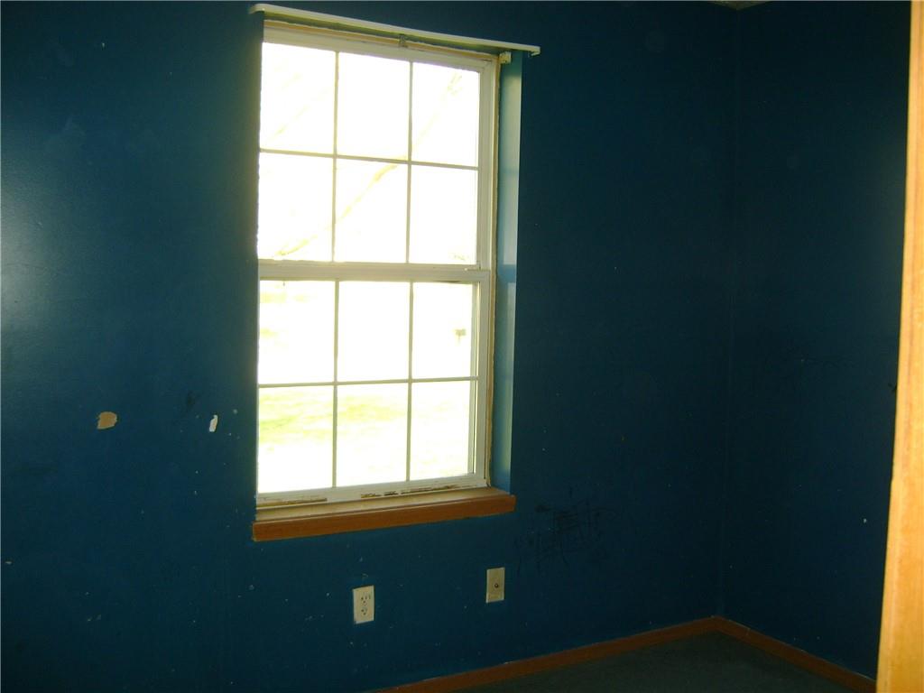 3489 East State Road Jamestown, PA 16134 - Photo 8 of 15 a view of an empty room with a window