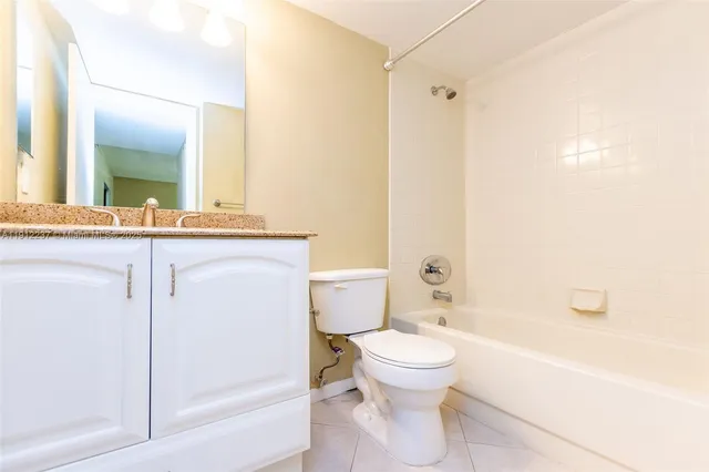 a bathroom with a toilet a sink and bathtub