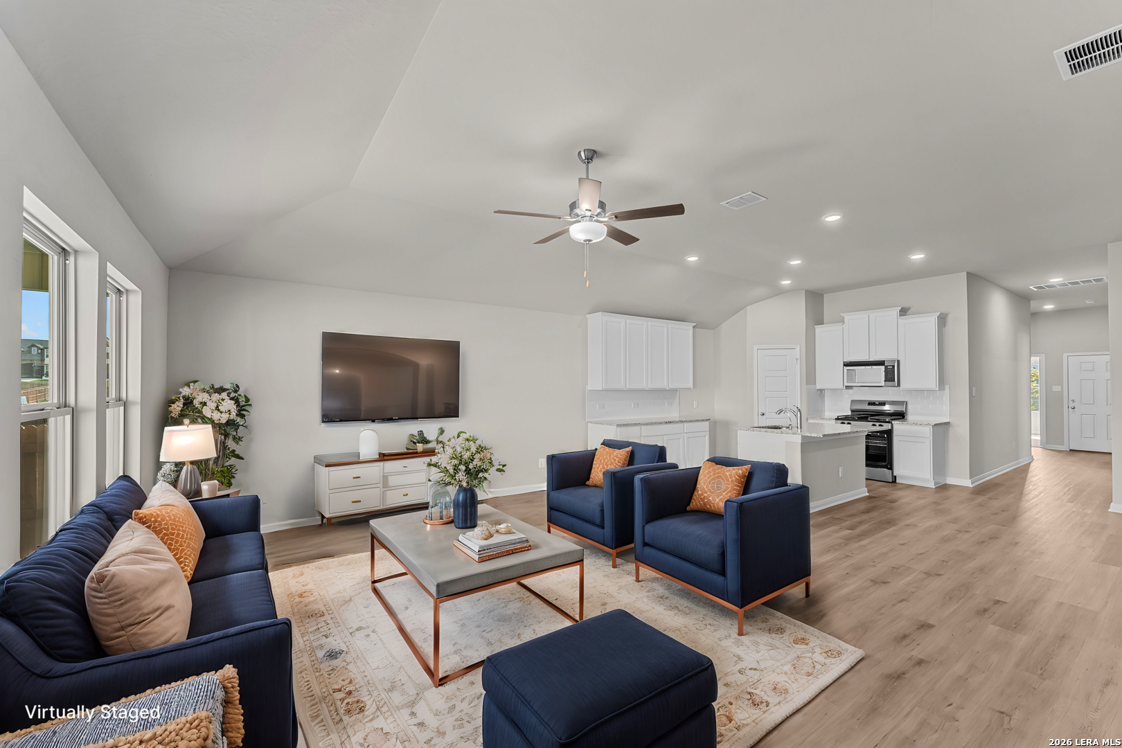 1036 Amber Lake Seguin, TX 78155 - Photo 5 of 27 a living room with furniture kitchen view and a flat screen tv
