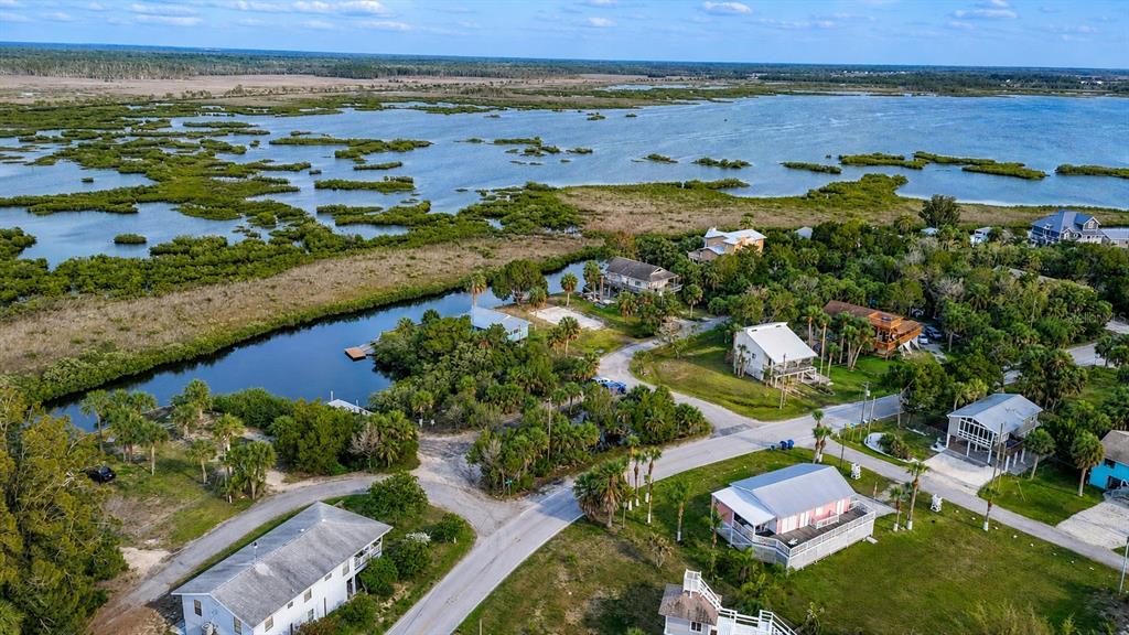 10166 Cabana Street Weeki Wachee, FL 34607 - Photo 3 of 7 an aerial view of residential houses with outdoor space