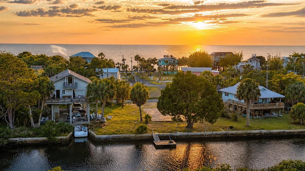 10166 Cabana Street Weeki Wachee, FL 34607 - Photo 4 of 7 a view of a lake with houses