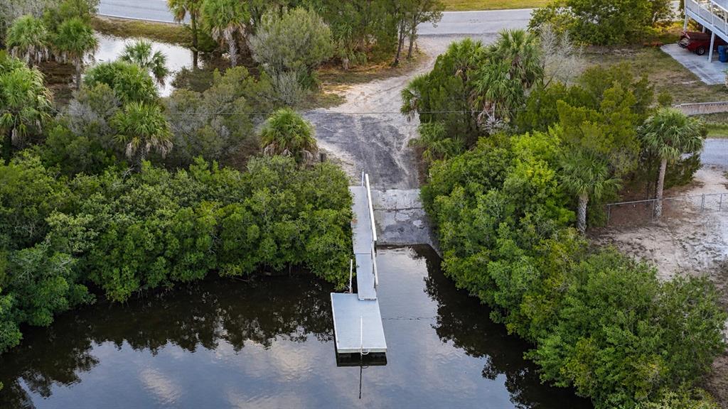 10166 Cabana Street Weeki Wachee, FL 34607 - Photo 7 of 7 an aerial view of a house with a yard and lake view