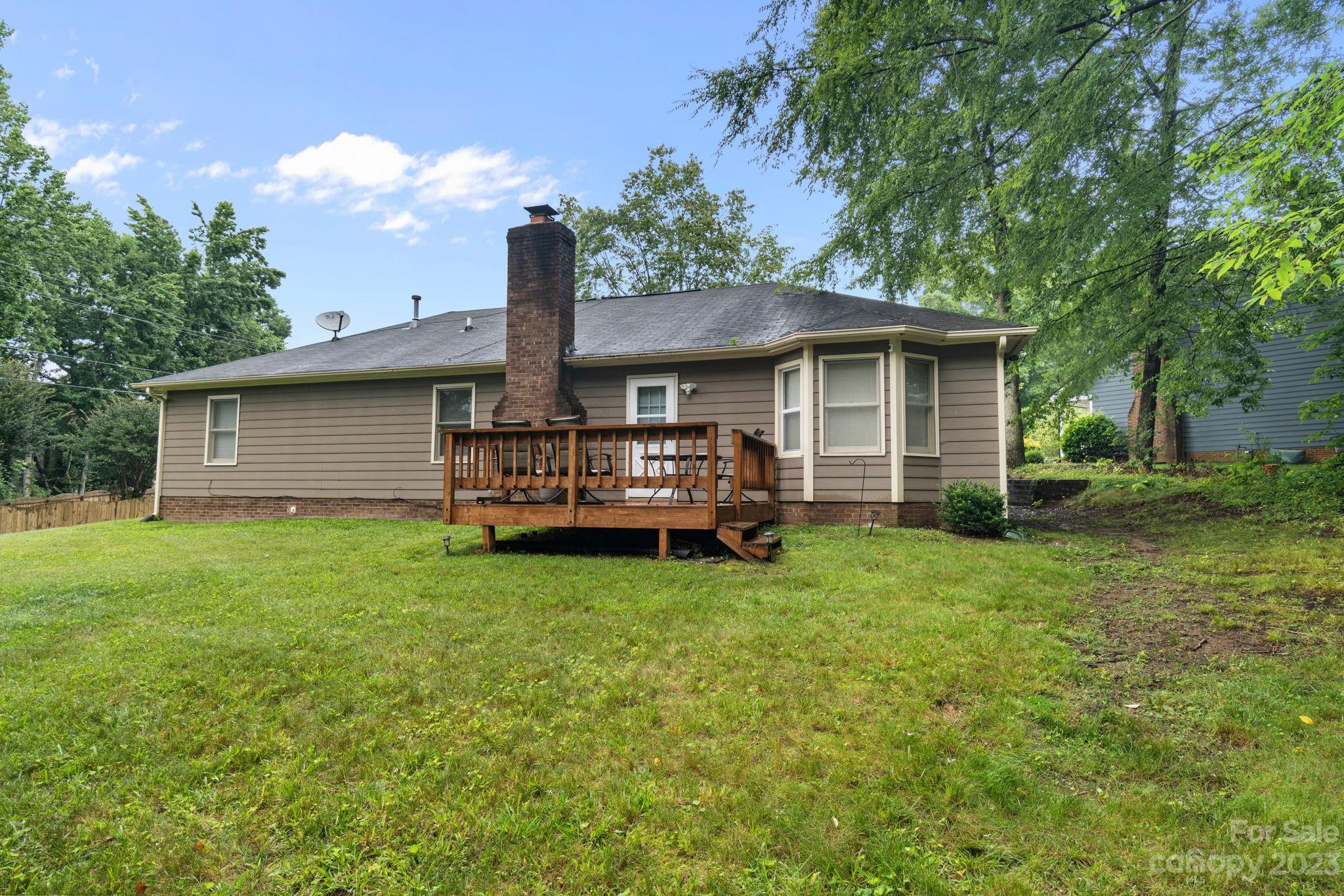 1007 Charcoal Ridge Court Matthews, NC 28105 - Photo 16 of 16 a view of a house with a backyard
