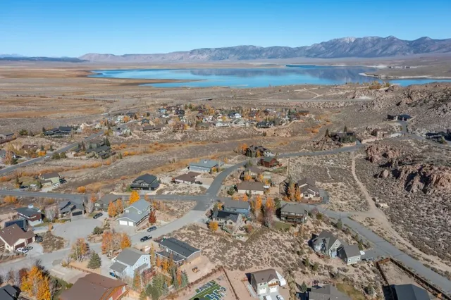 an aerial view of a house with a lake view