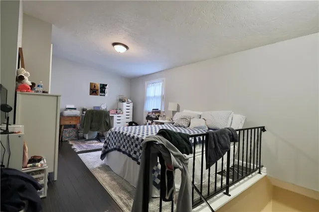a view of a livingroom with furniture and a flat screen tv