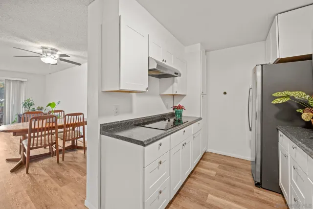 a kitchen with stainless steel appliances granite countertop a cabinets and a stove
