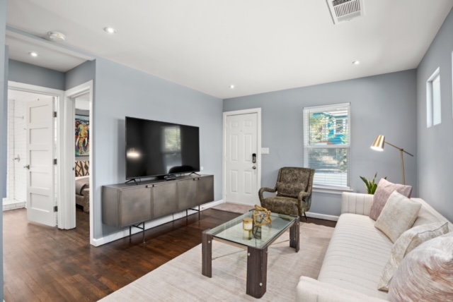 1183 Coleto Street Austin, TX 78702 - Photo 4 of 17 a living room with furniture and a flat screen tv