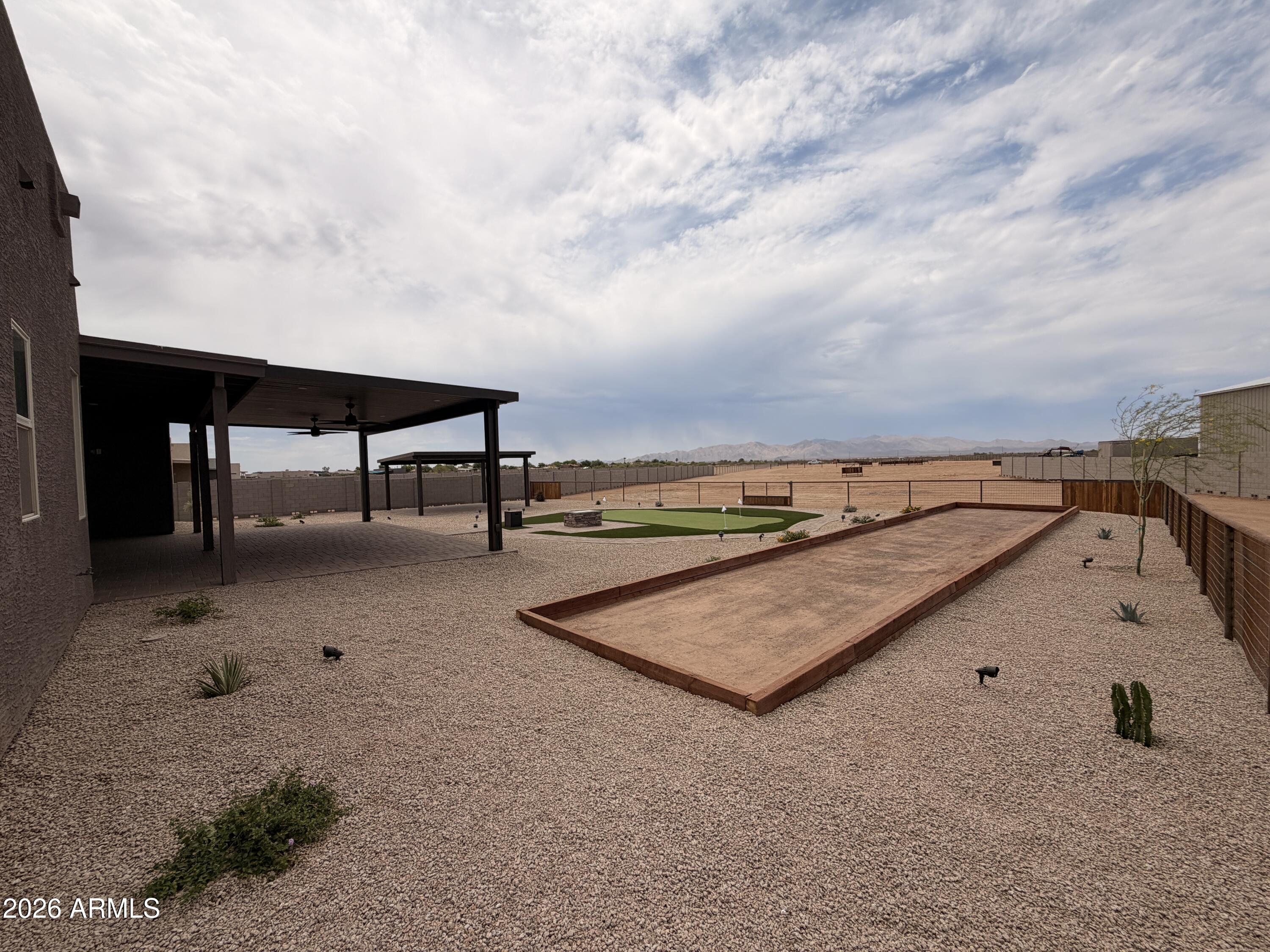 23175 West Skinner Road Wittmann, AZ 85361 - Photo 23 of 25 a view of a terrace with sky view