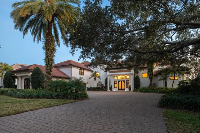 a view of multiple houses with a yard and tree s