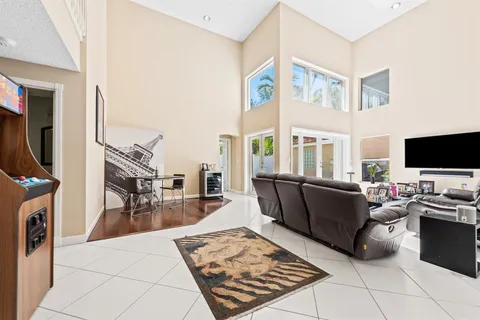 a living room with furniture and a flat screen tv