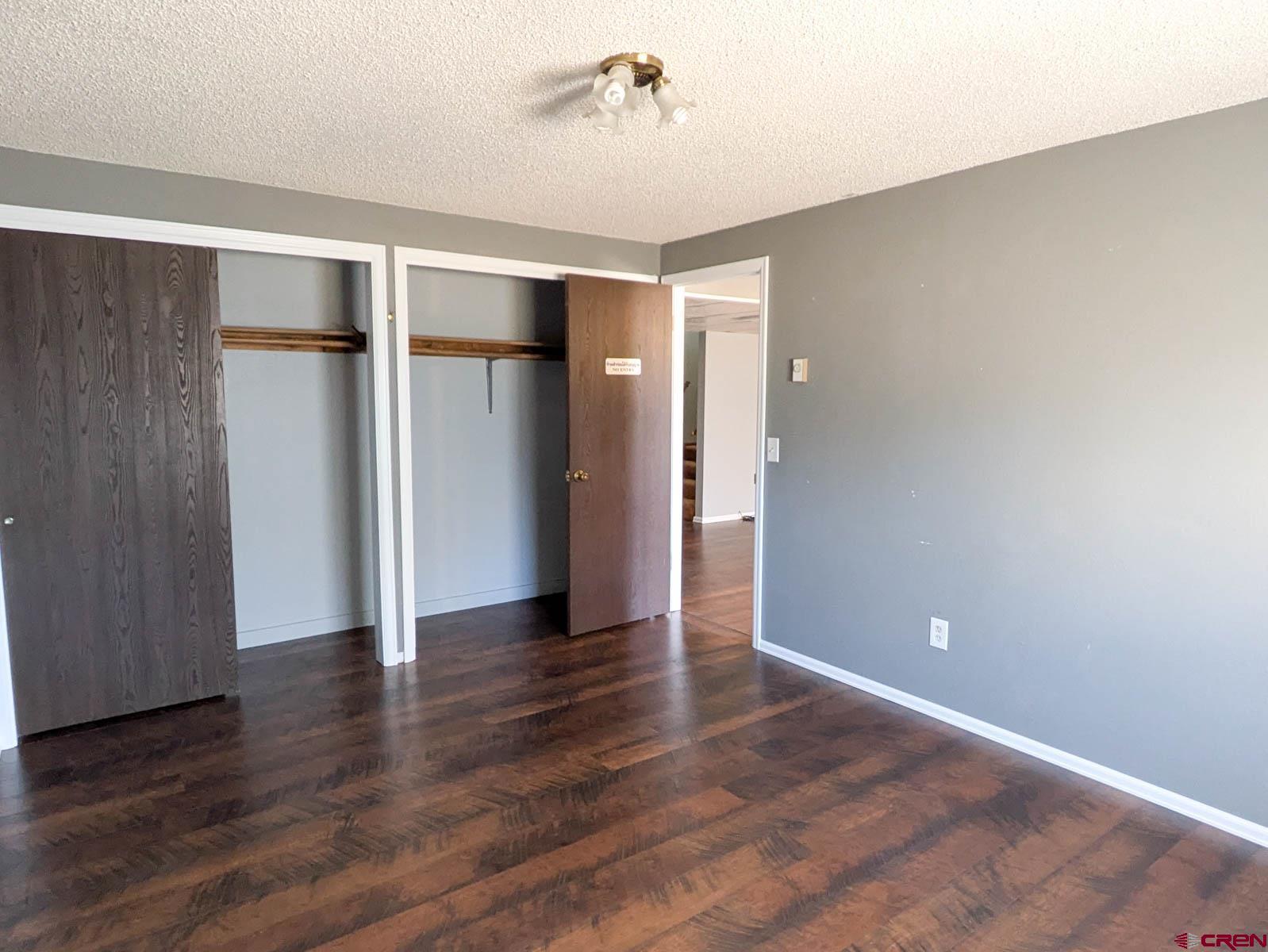39594 Pitkin Road Paonia, CO 81428 - Photo 20 of 35 a view of an empty room with wooden floor