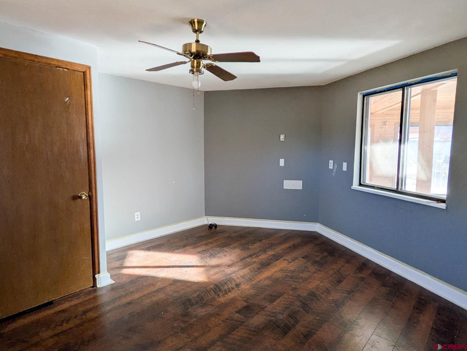 39594 Pitkin Road Paonia, CO 81428 - Photo 22 of 35 a view of an empty room with window and wooden floor