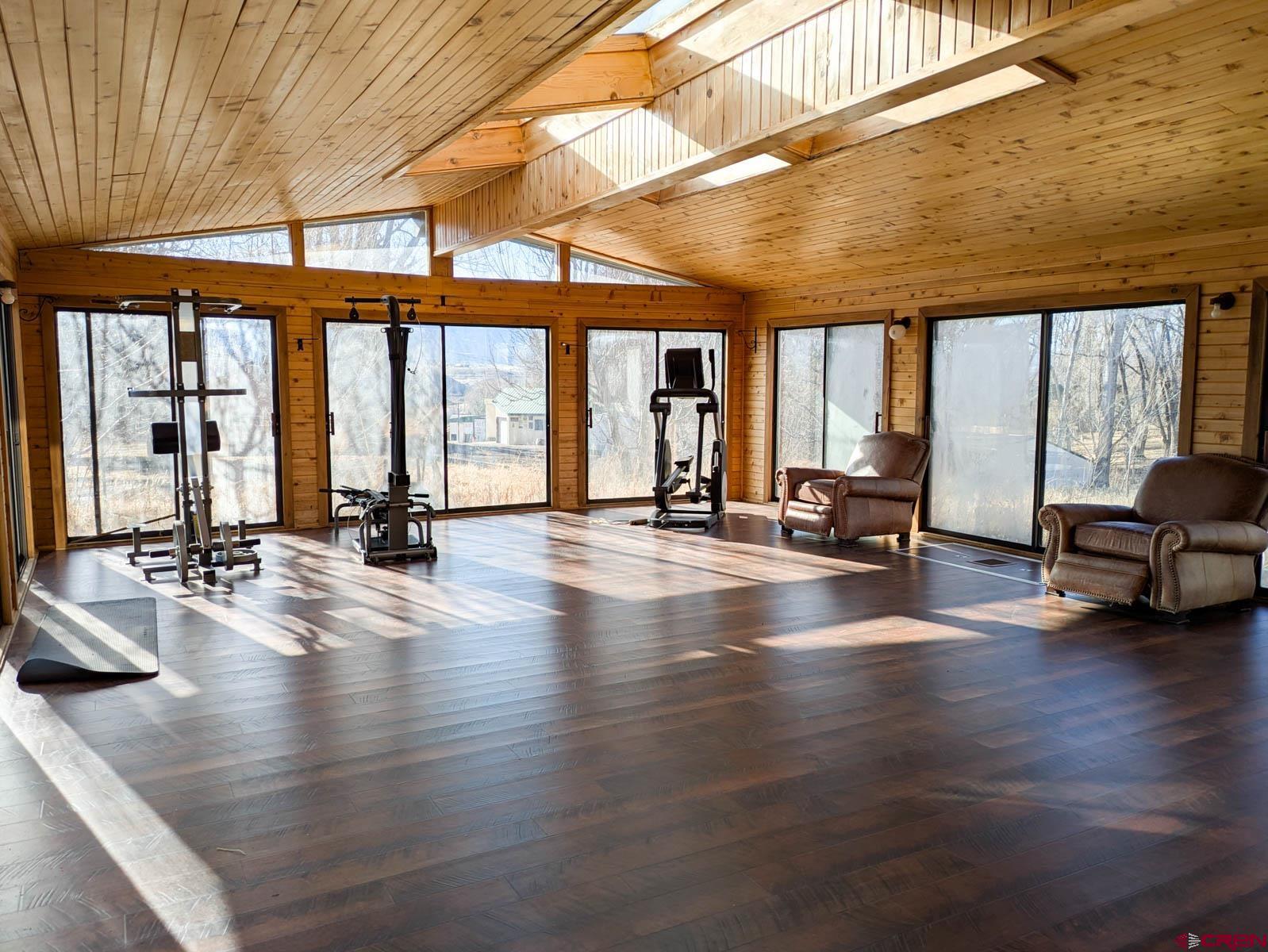 39594 Pitkin Road Paonia, CO 81428 - Photo 26 of 35 a view of a living room with hardwood floor and a large window