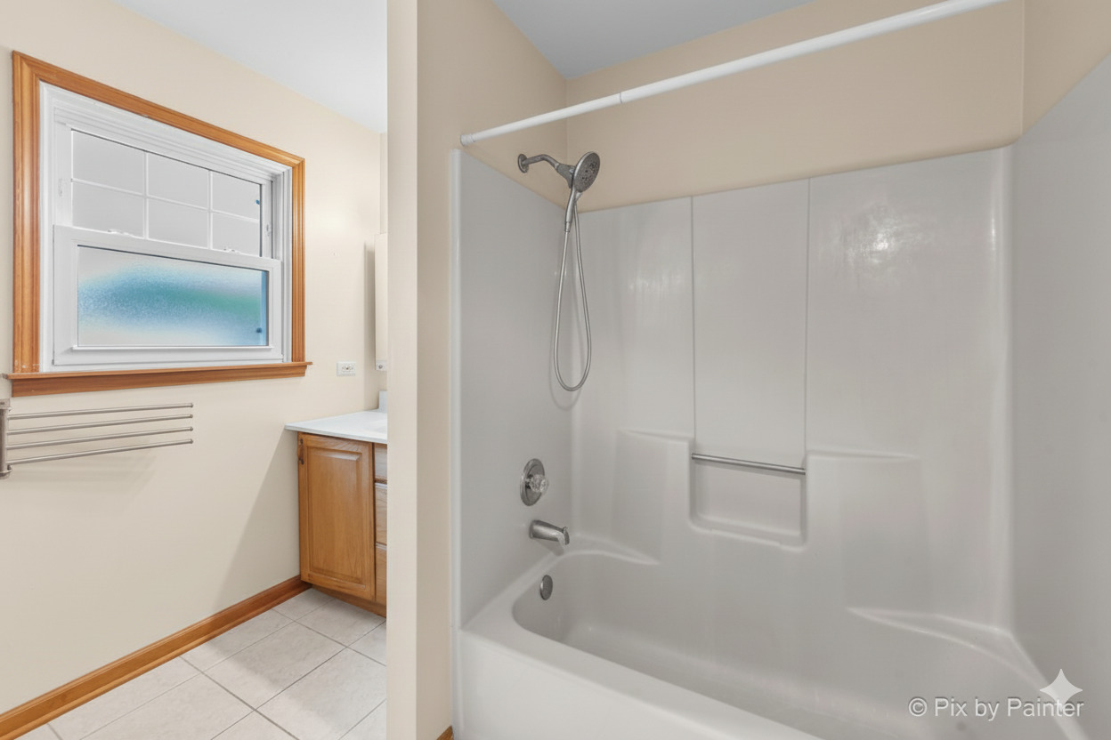 31 West Harrison Road Lombard, IL 60148 - Photo 21 of 31 a bathroom with a bathtub and a shower