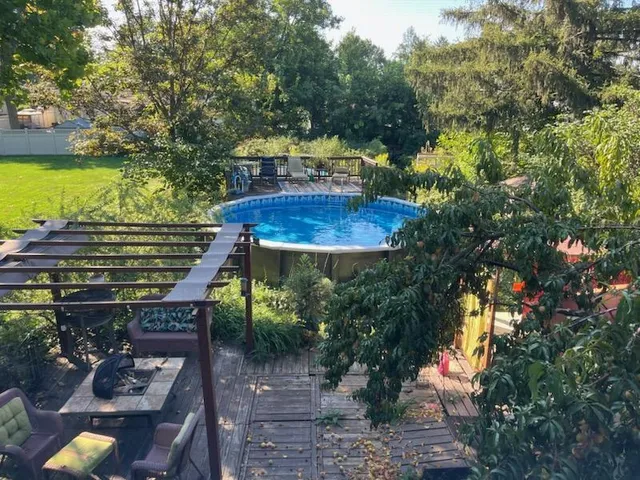 a view of a backyard with plants and a patio