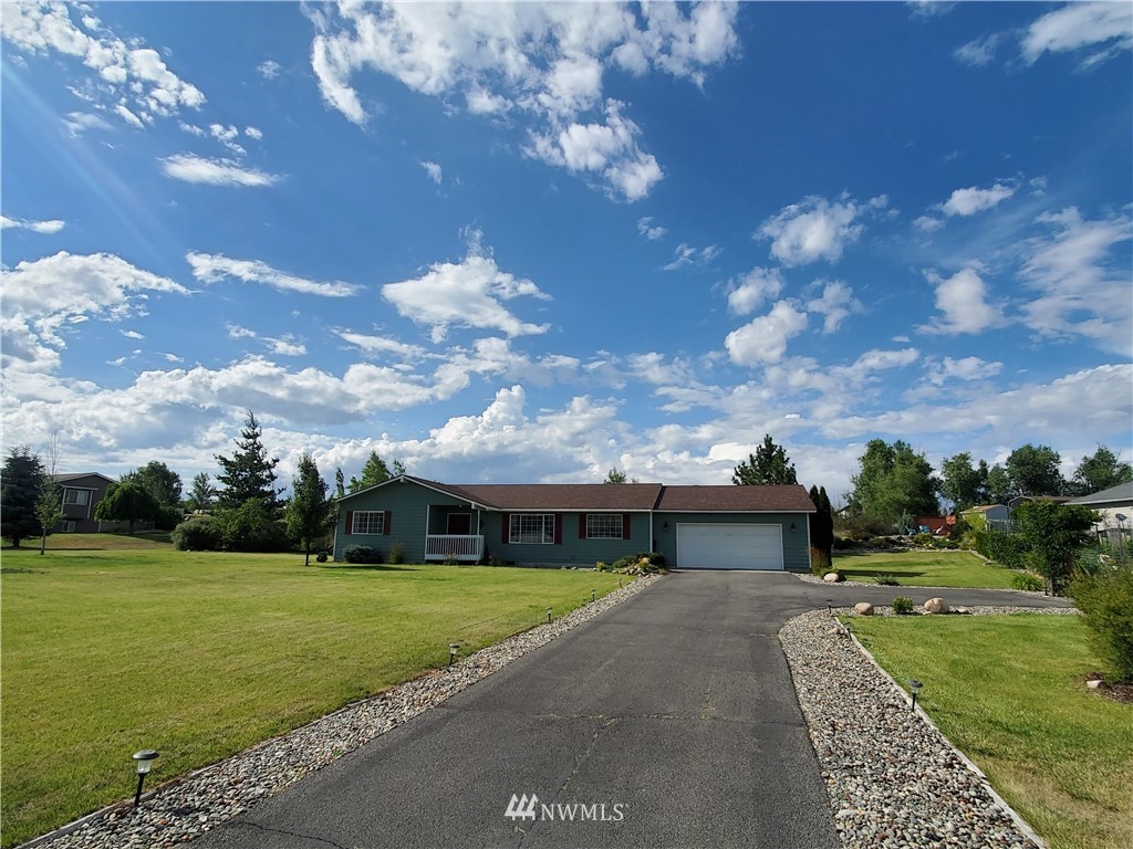 320 Omak River Road Omak, WA 98841 - Photo 2 of 3 front view of a house with a big yard