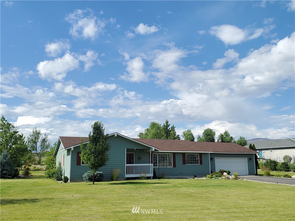 320 Omak River Road Omak, WA 98841 - Photo 3 of 3 a front view of house with yard space and swimming pool