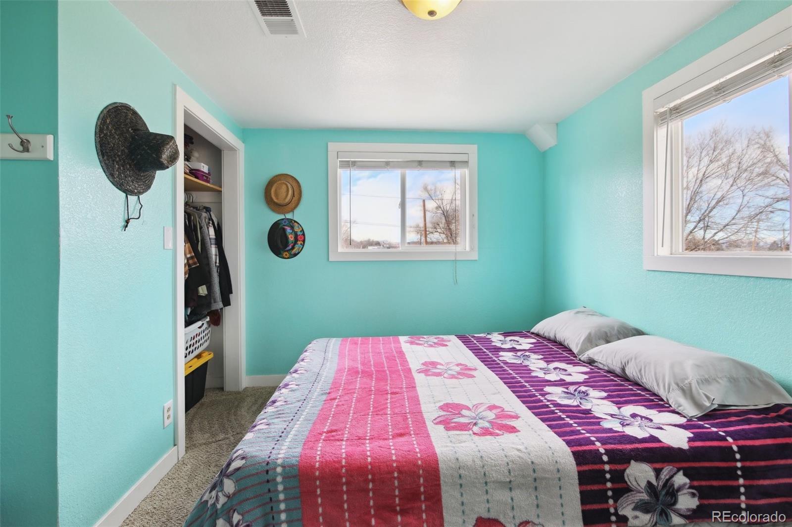 950 South Wolff Street Denver, CO 80219 - Photo 12 of 39 a bedroom with a bed and a window