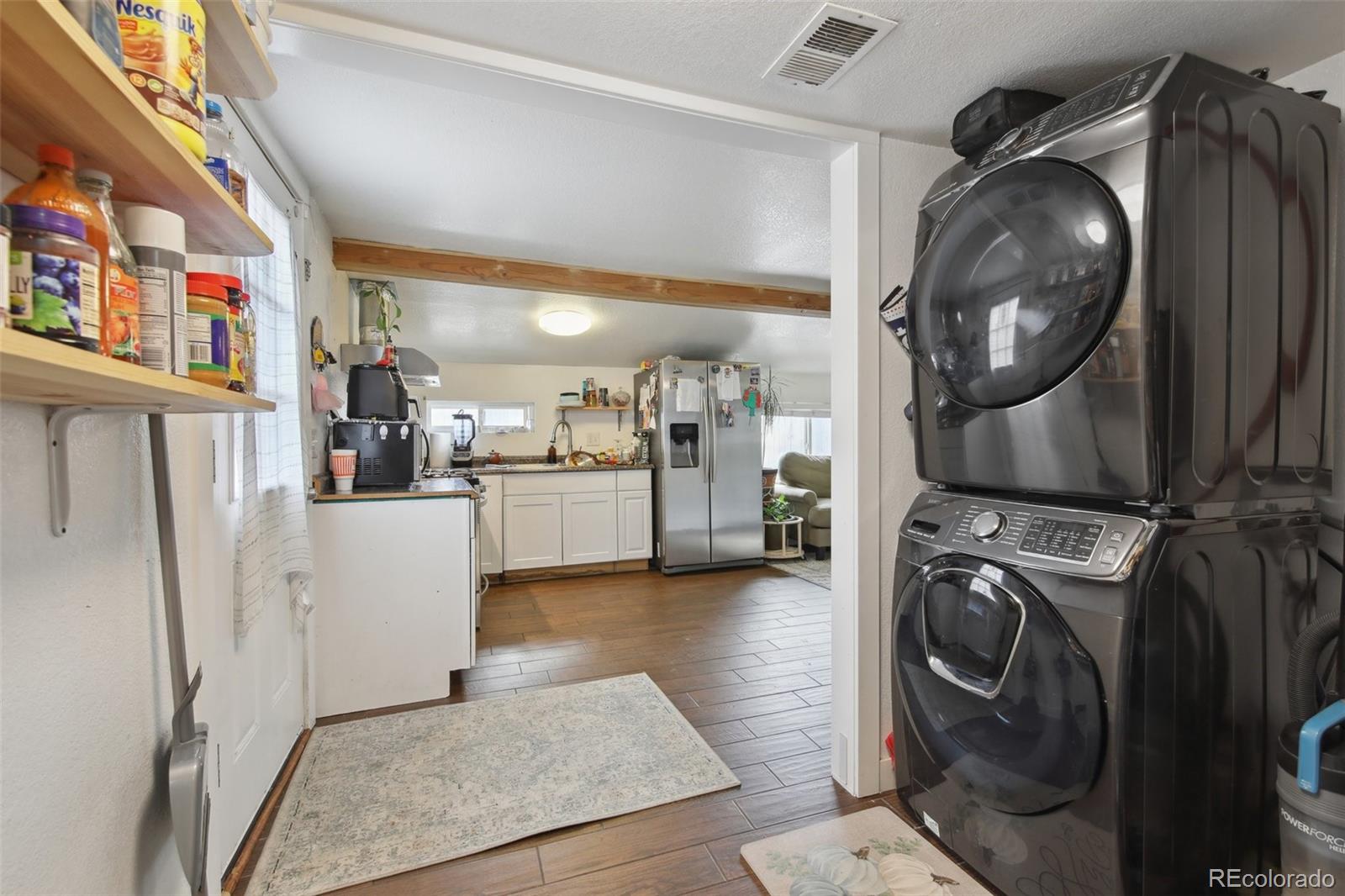 950 South Wolff Street Denver, CO 80219 - Photo 15 of 39 a view of living room washer and dryer