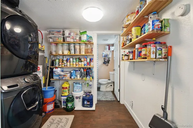 a view of living room with baby crib and furniture