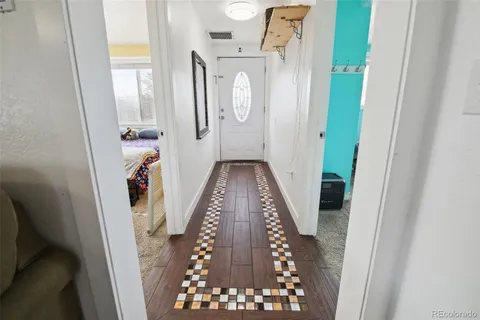 a view of a hallway with front door