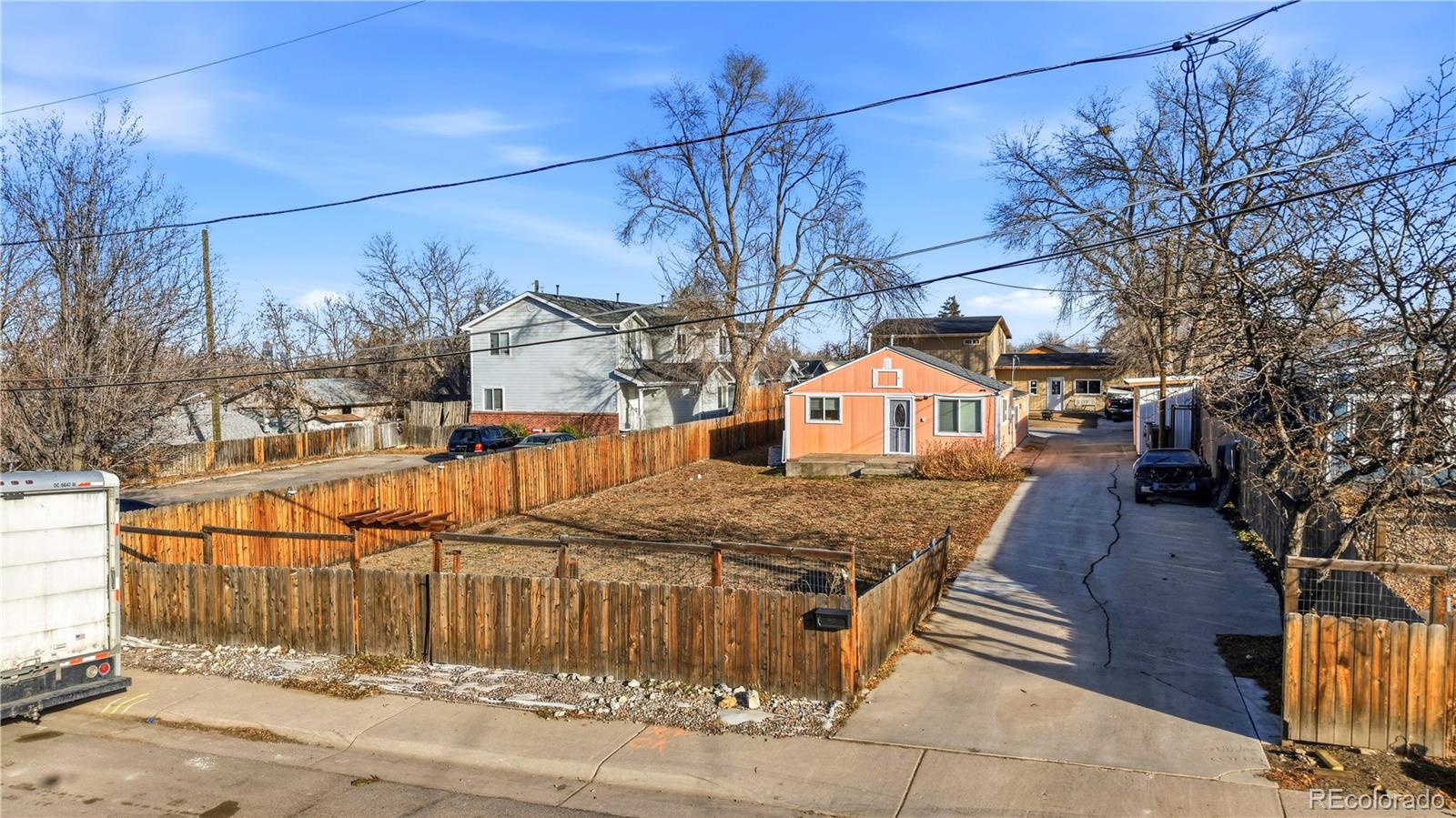 950 South Wolff Street Denver, CO 80219 - Photo 2 of 39 a view of a house with wooden fence