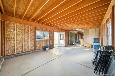 a view of an empty room with windows