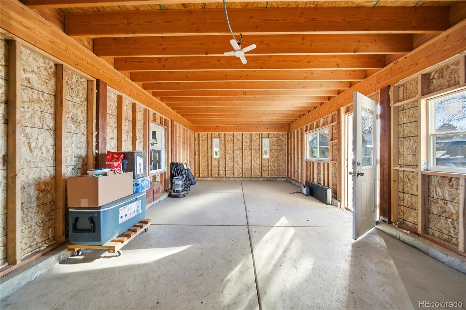 950 South Wolff Street Denver, CO 80219 - Photo 24 of 39 a room with lots of windows and furniture