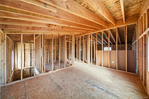 a view of a room with wooden walls