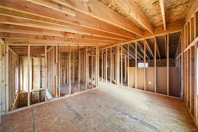 a view of a room with wooden walls