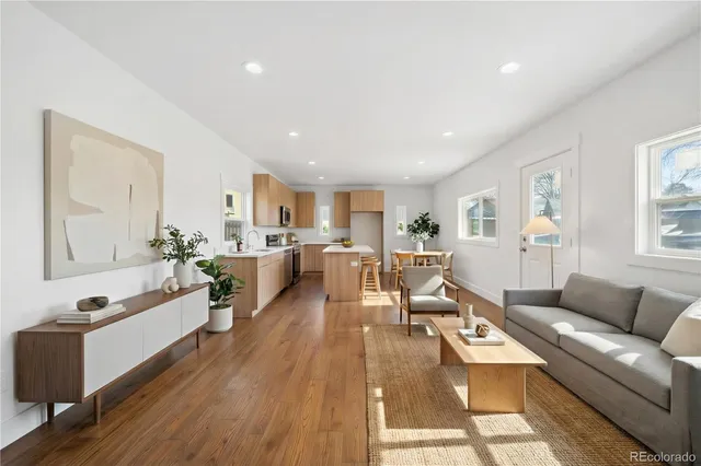 a view of kitchen and hall with wooden floor