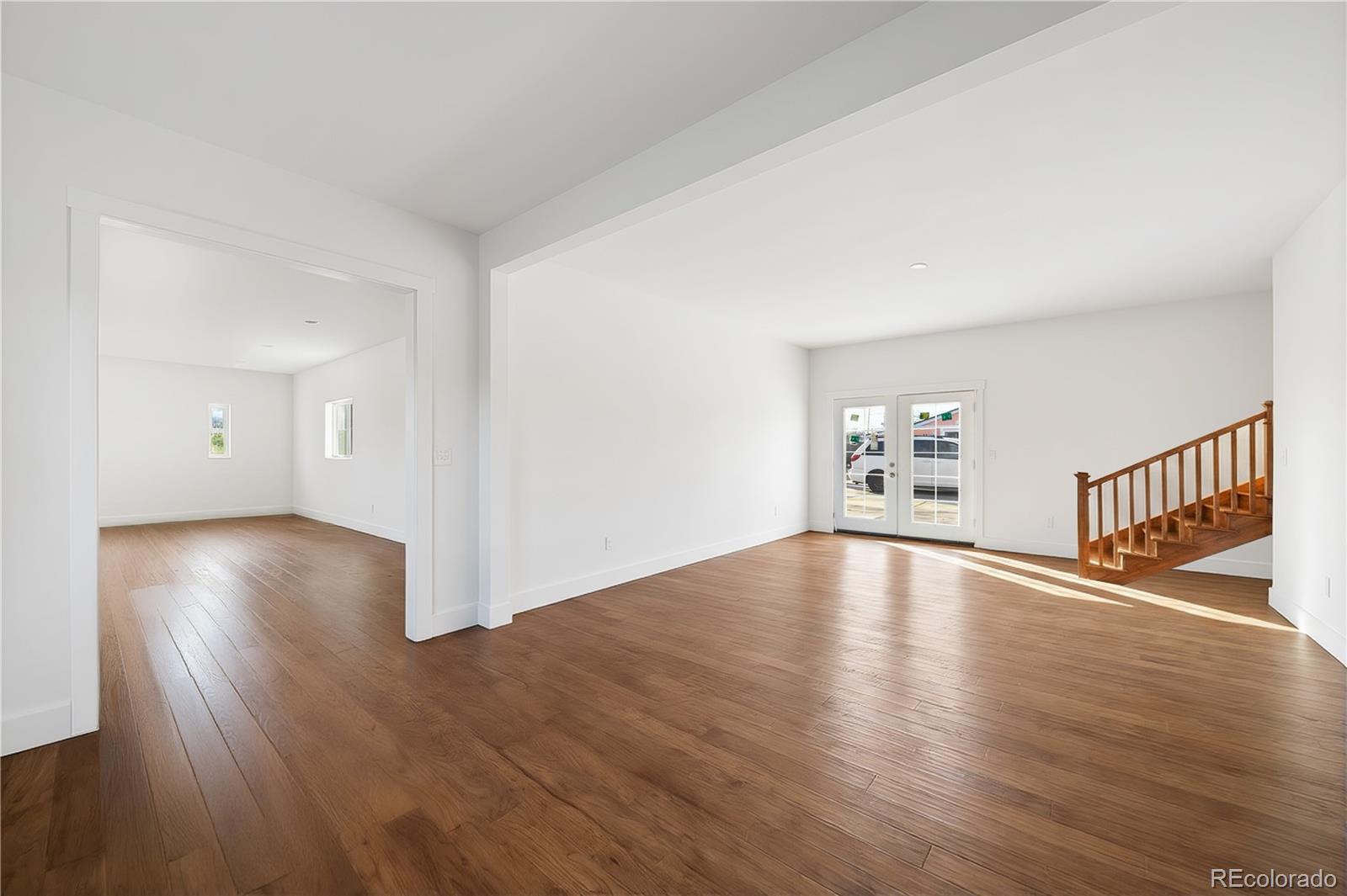 950 South Wolff Street Denver, CO 80219 - Photo 36 of 39 a view of livingroom with hardwood floor and window
