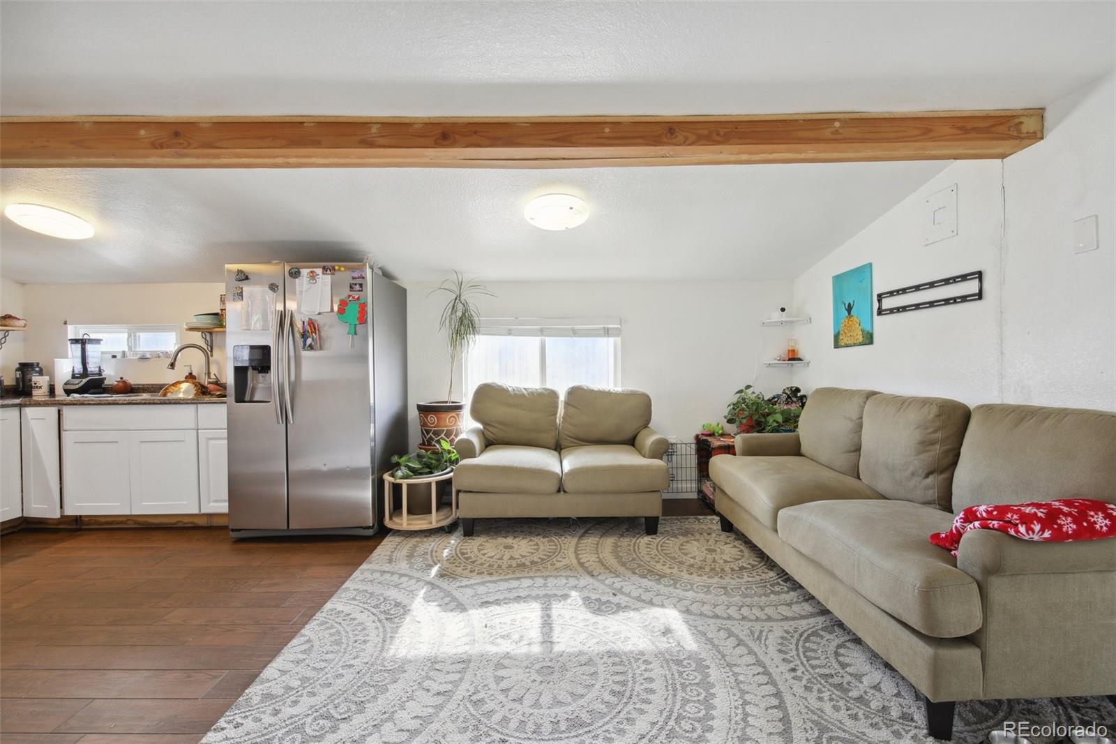 950 South Wolff Street Denver, CO 80219 - Photo 5 of 39 a living room with furniture and a couch
