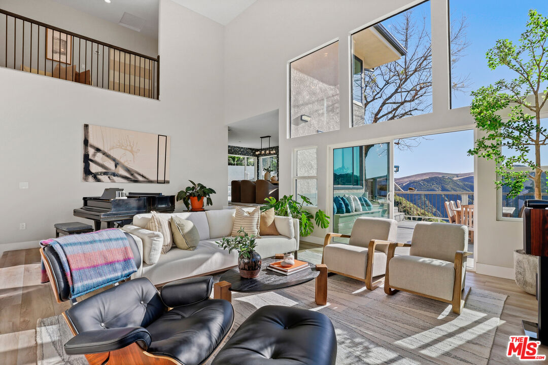 53 Saddlebow Road Bell Canyon, CA 91307 - Photo 12 of 66 a living room with furniture and a potted plant