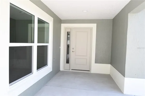 a view of an empty room with closet