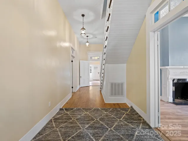 a bathroom with a sink vanity mirror and shower