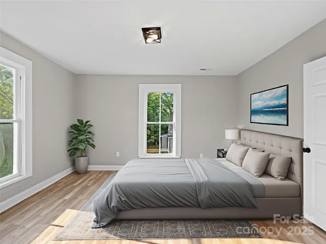 a bathroom with a sink a toilet and a window