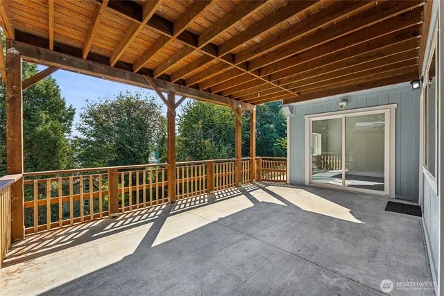 a view of porch with wooden floor