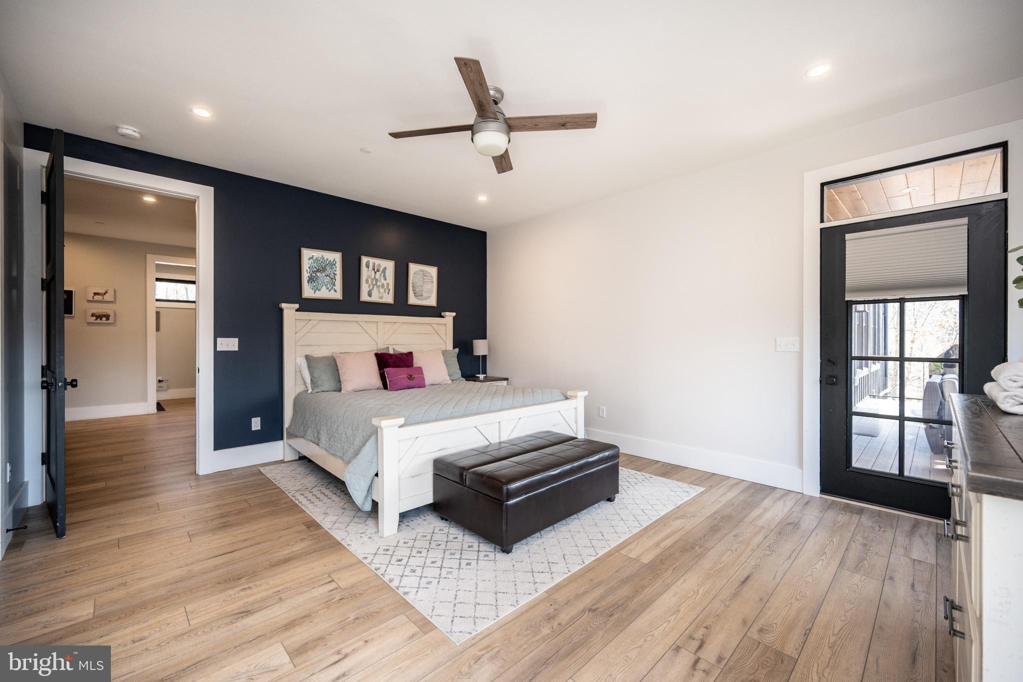 415 Mountaintop Road McHenry, MD 21541 - Photo 19 of 134 a bedroom with a bed and a large window