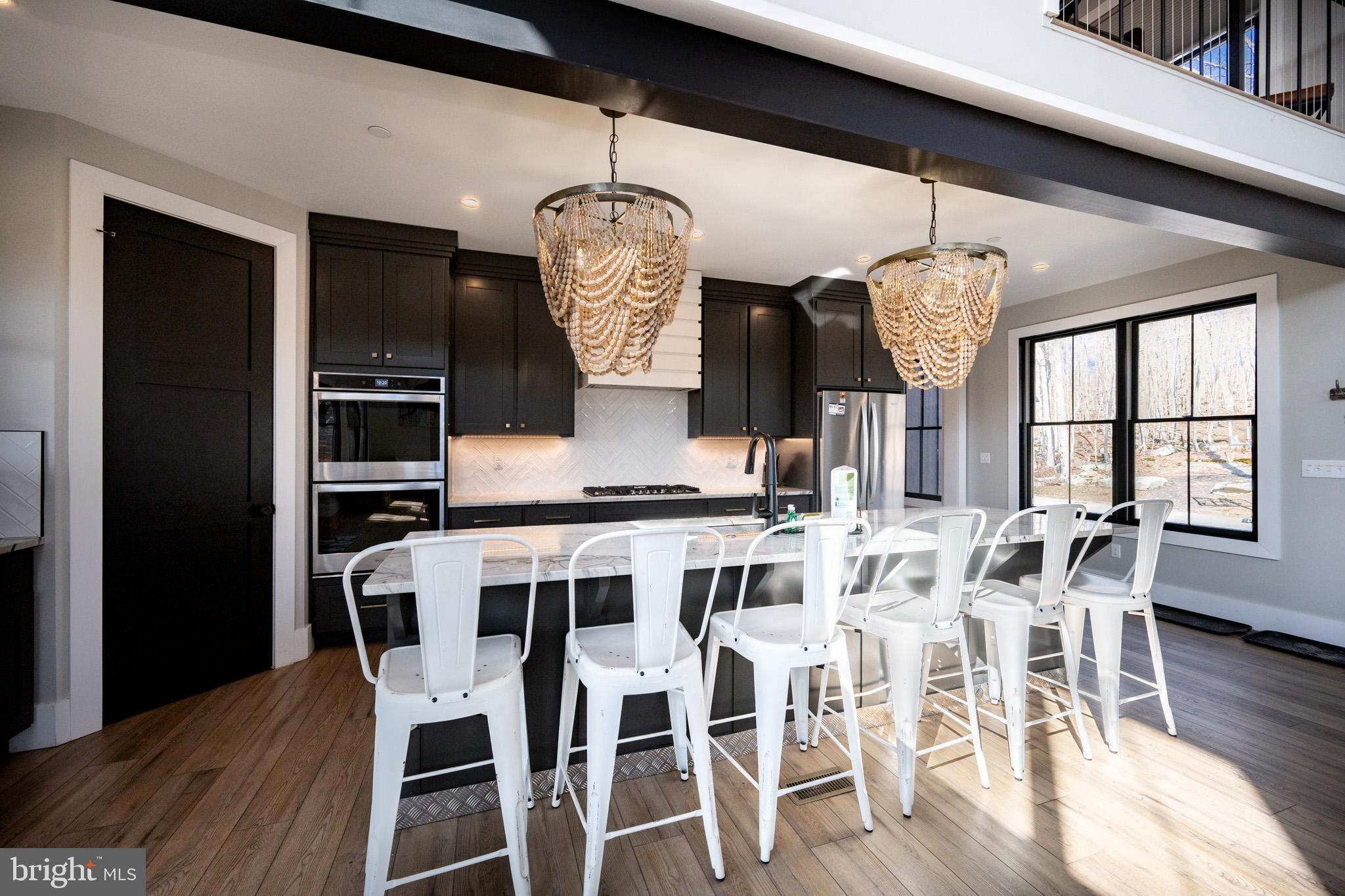 415 Mountaintop Road McHenry, MD 21541 - Photo 35 of 134 a view of a dining room with furniture window and wooden floor