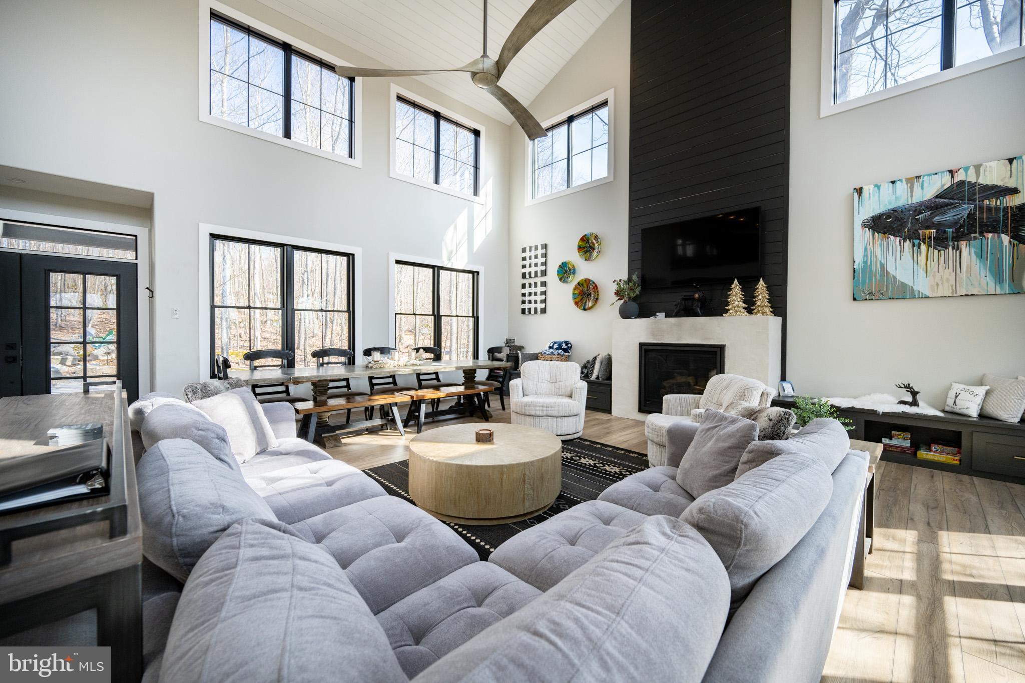 415 Mountaintop Road McHenry, MD 21541 - Photo 37 of 134 a living room with furniture a fireplace and a large window