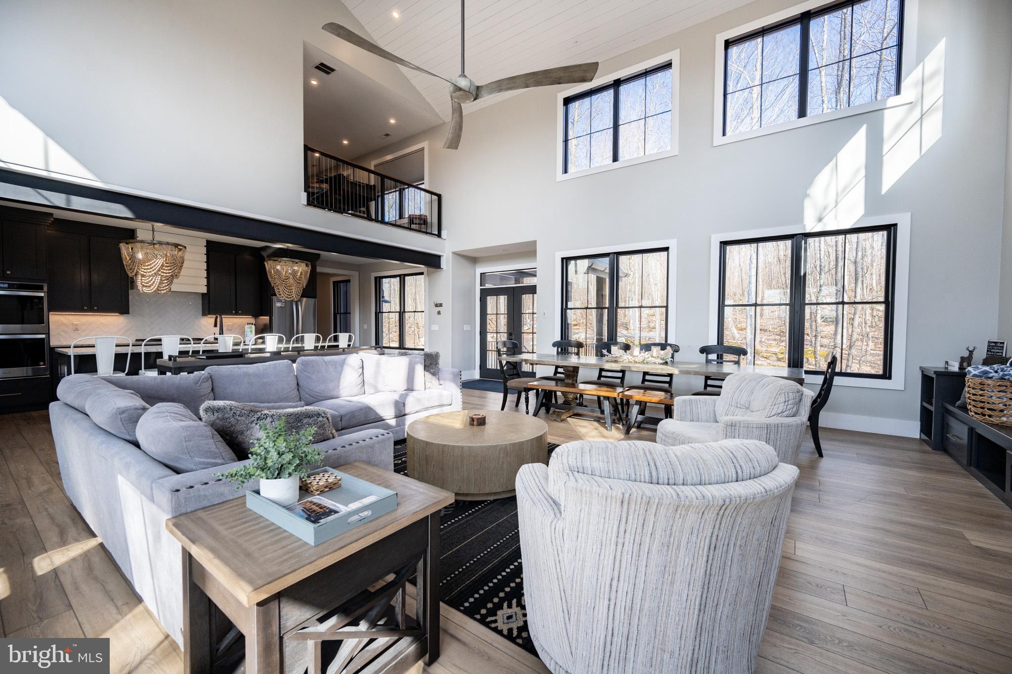 415 Mountaintop Road McHenry, MD 21541 - Photo 39 of 134 a living room with fireplace furniture and a wooden floor