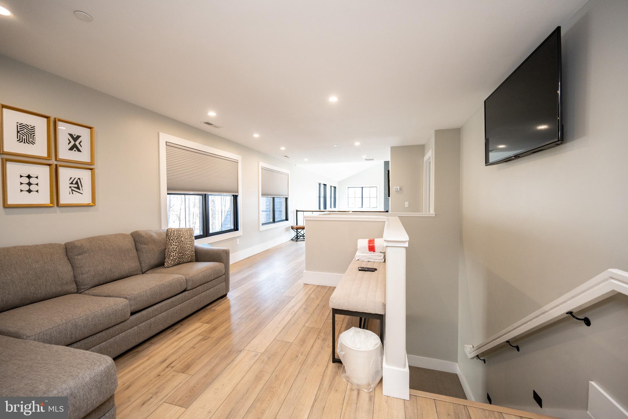 415 Mountaintop Road McHenry, MD 21541 - Photo 46 of 134 a living room with furniture and a flat screen tv